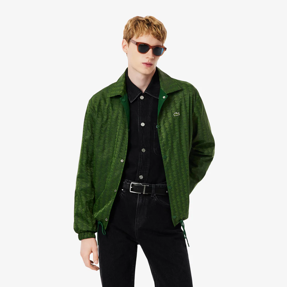 Description & care This jacket is packed with Lacoste style and expert technical touches. The reversible design features monochrome ripstop on one side and a signature monogram jacquard motif on the other, both with a water-repellent treatment to protect you from the elements in style. A must-have piece, with a relaxed cut and ergonomic finish details. Water-repellent ripstop and jacquard fabrics Central closure with logo snaps Two snap-close pockets on sides Adjustable drawstring waist Elasticated cuffs